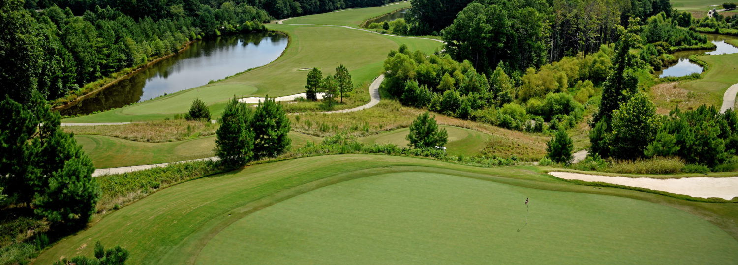 Lonnie Poole Golf Course, with Raleigh skyline in the distance.